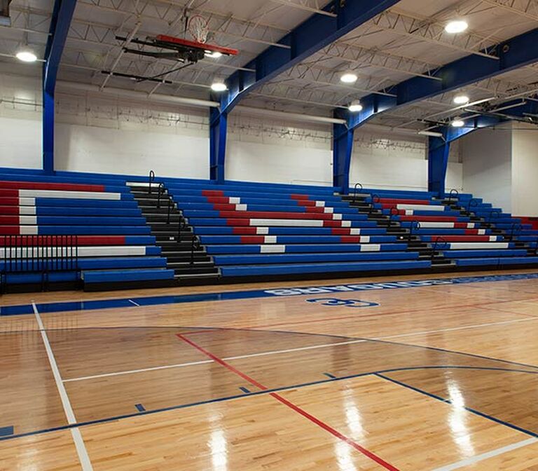 Cooper High School gymnasium telescopic bleacher seating with Infinity Irwin Seating Company - Telescopic Division