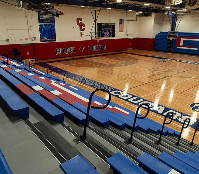Cooper High School gymnasium telescopic bleacher seating with Infinity Irwin Seating Company - Telescopic Division