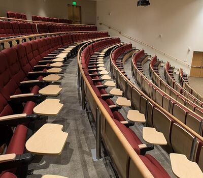 University Of South Carolina Darla Moore School Business With Custom Signature Lecture Hall Fixed Seating Wood Backs Solid Comfort Curved Arms And 120 Square Inch Writing Tablets Irwin